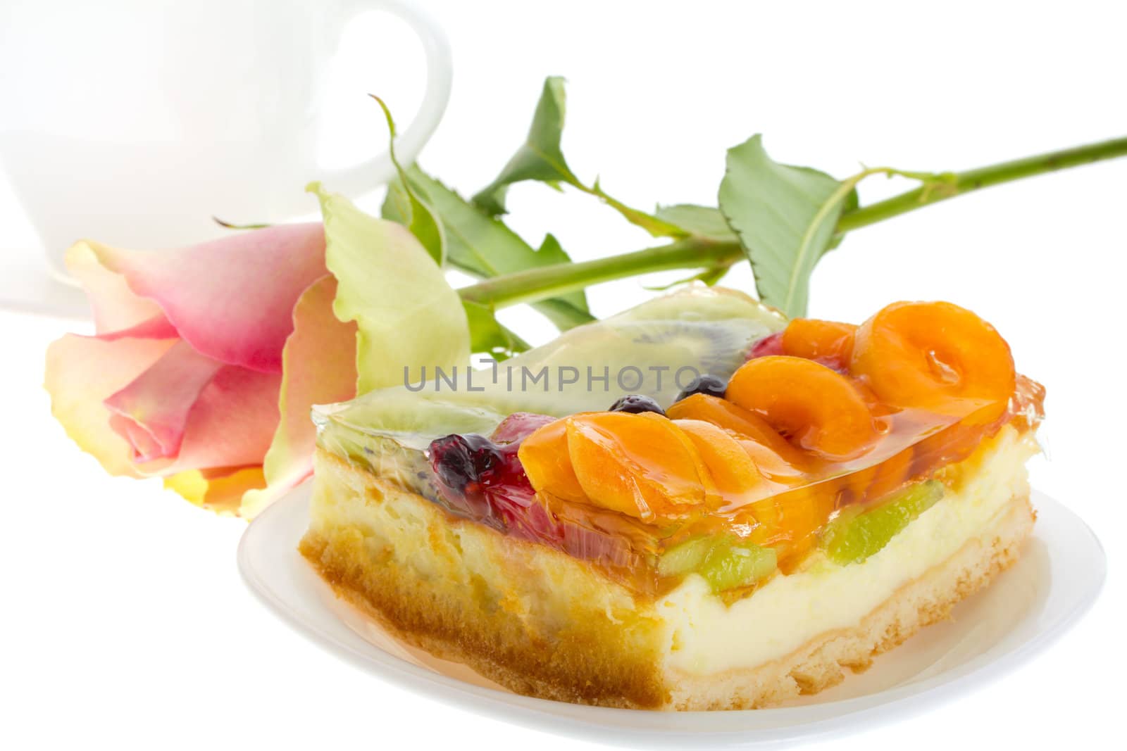 close-up curd cake with fruits and rose, isolated on white