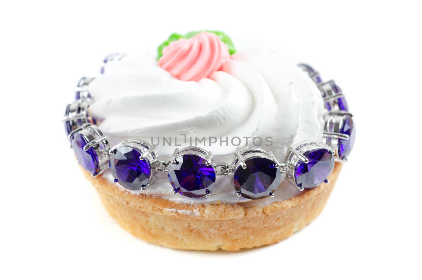 cupcake and bijouterie bracelet with blue gems on a white background