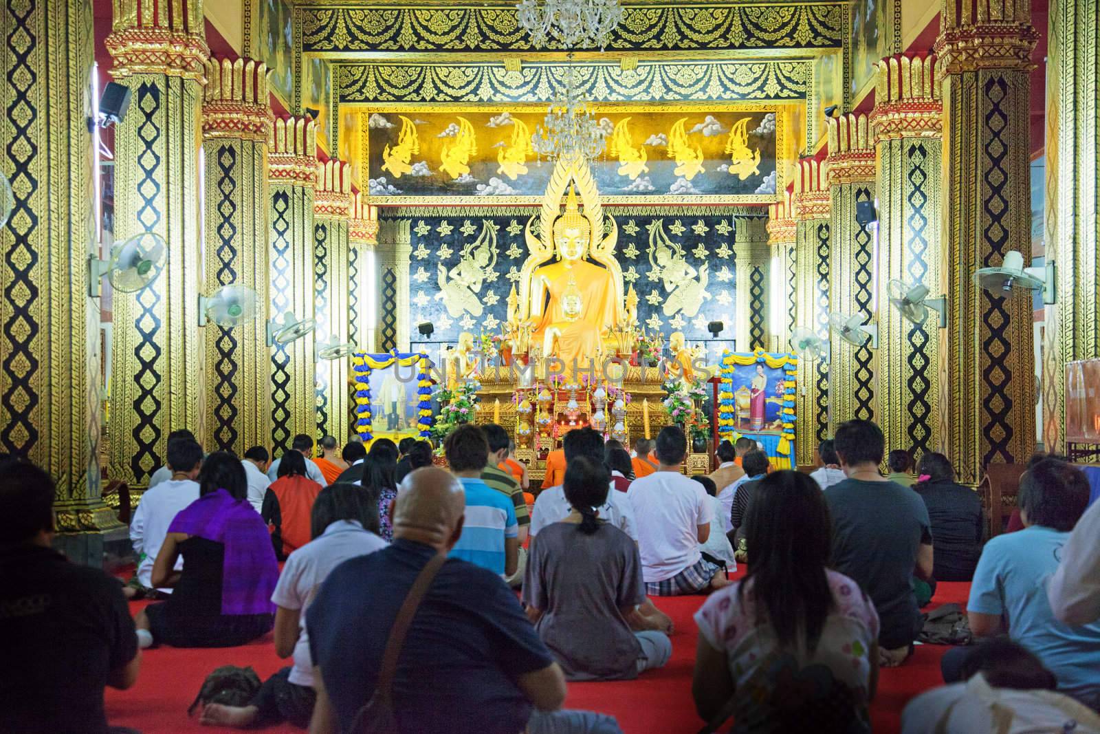 People praying in the temple by Farina6000