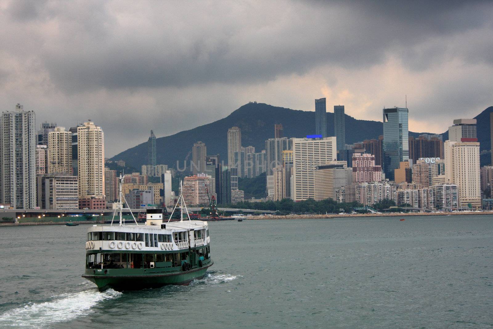 Ferry boat in Victoria Harbor, Hong Kong ,before storm comoing