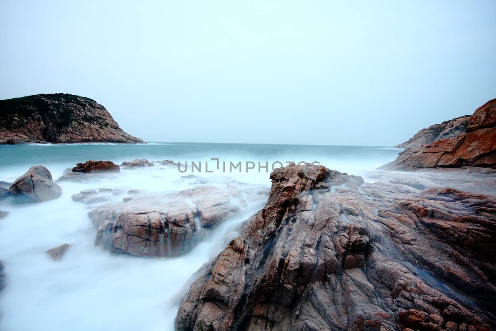 Sea stones at sunset in hong kong.