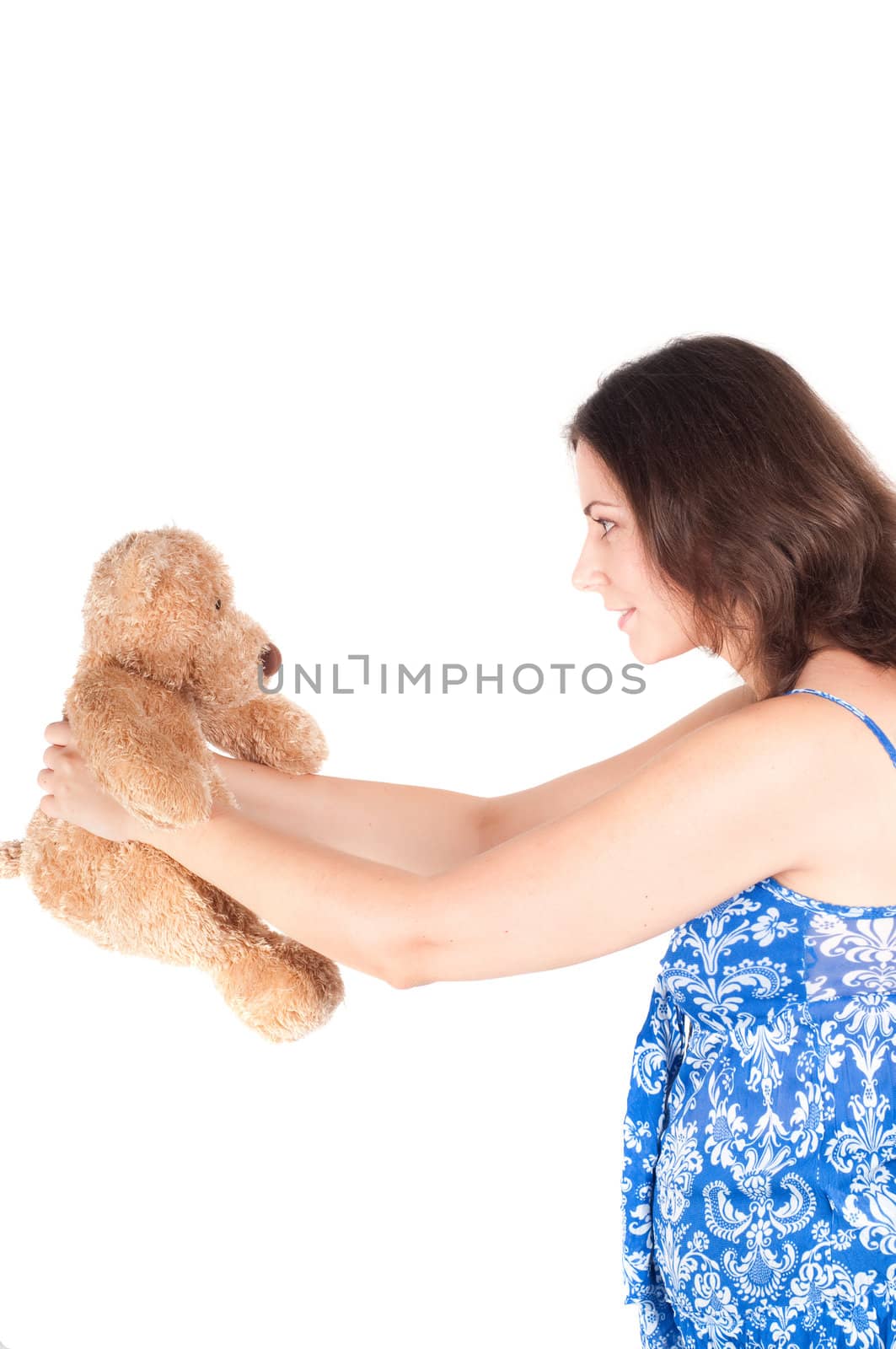 Portrait of pretty pregnant woman with toy bear isolated on white