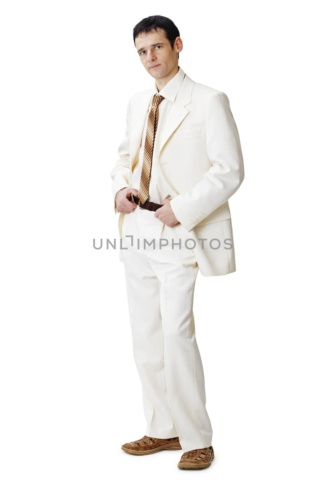 The young man in a light suit on a white background