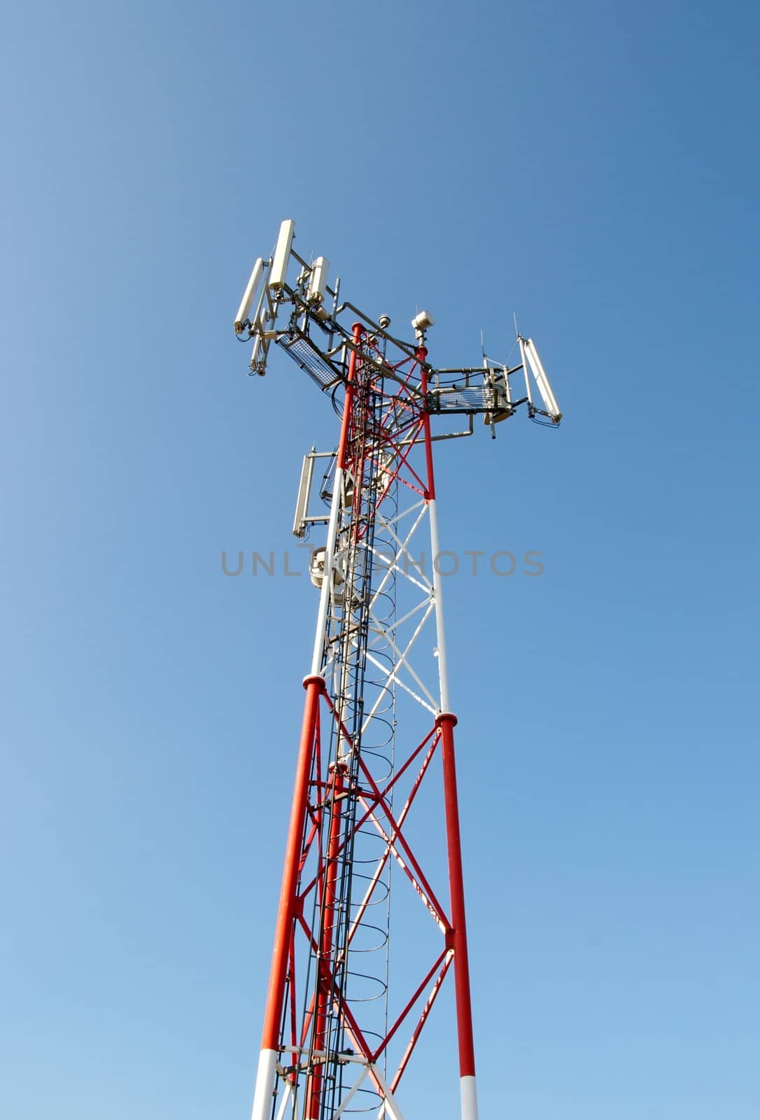 Communication tower against blue sky