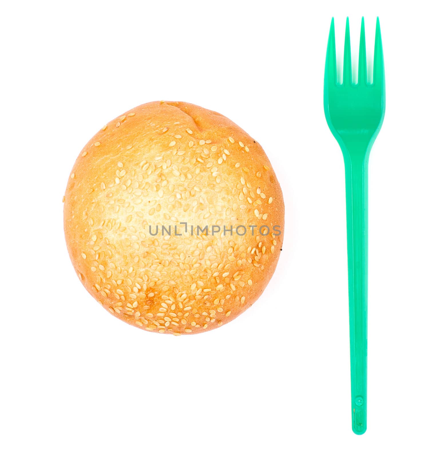 Bun with sesame and plastic fork isolated on the white background