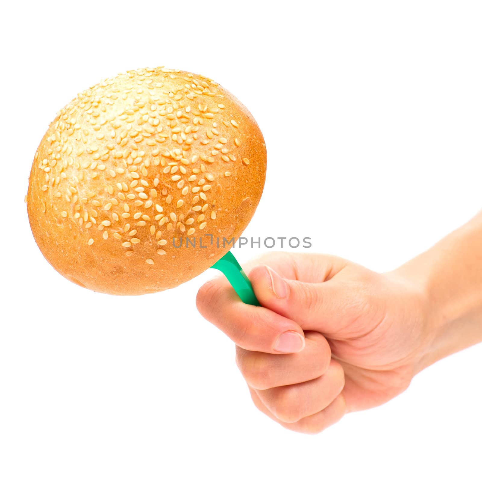 Hand holding a bun on the fork isolated on the white background