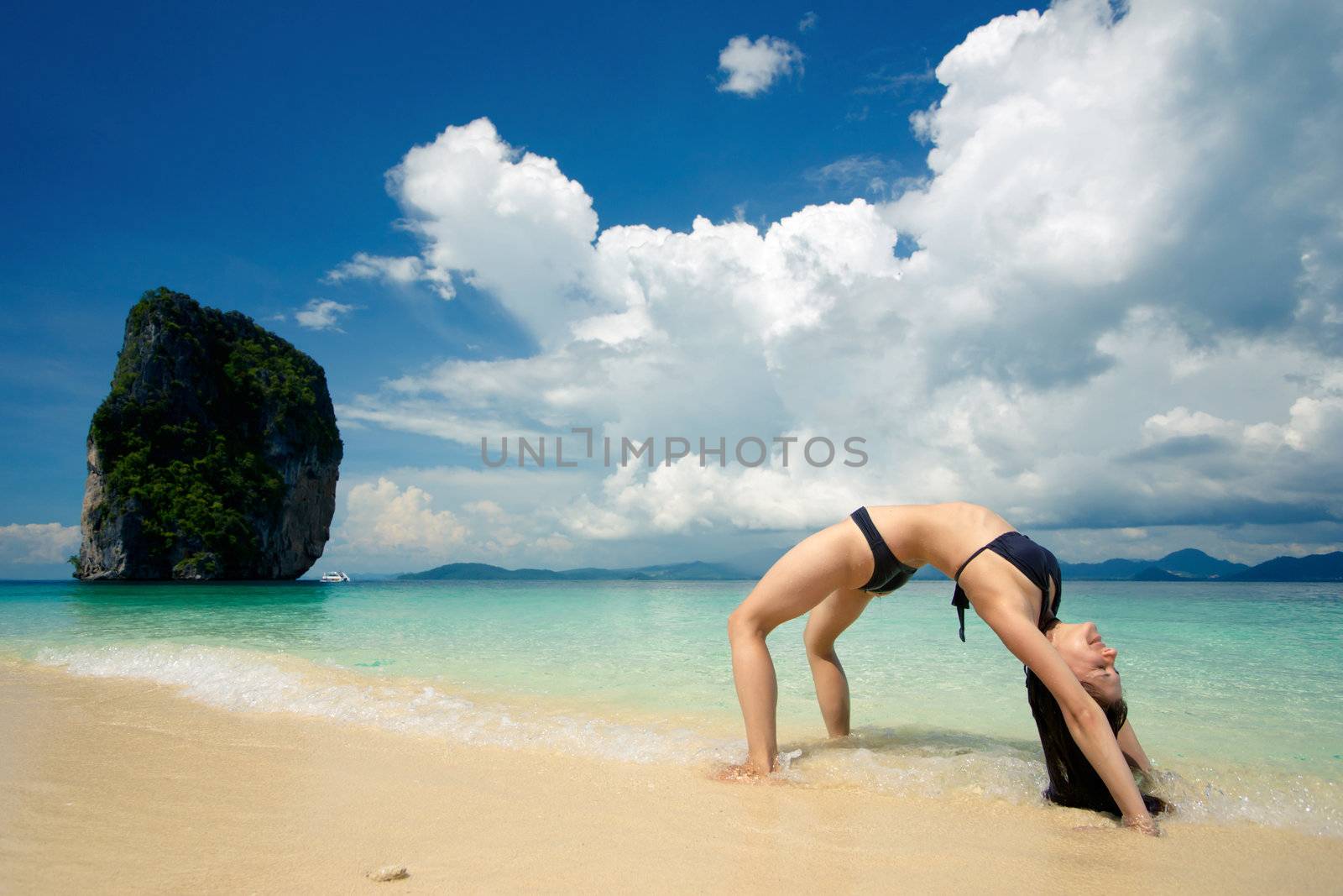 Acrobatic trick on the sandy beach