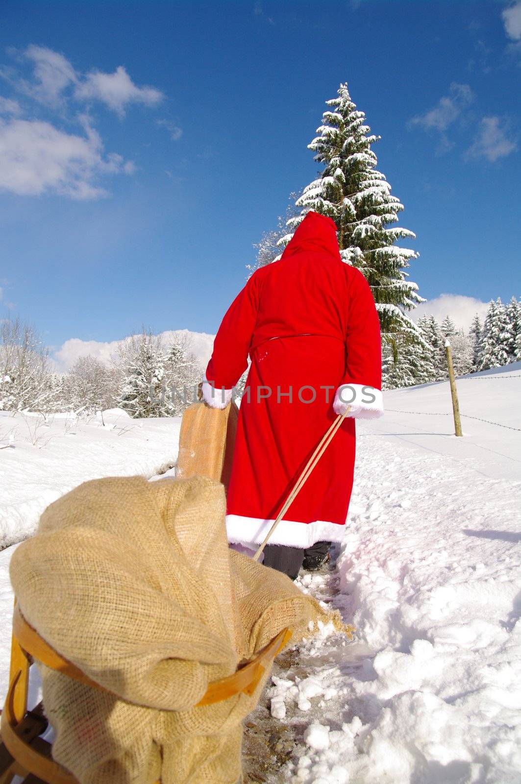 Santa Claus, Father Christmas in a beautiful winter landscape