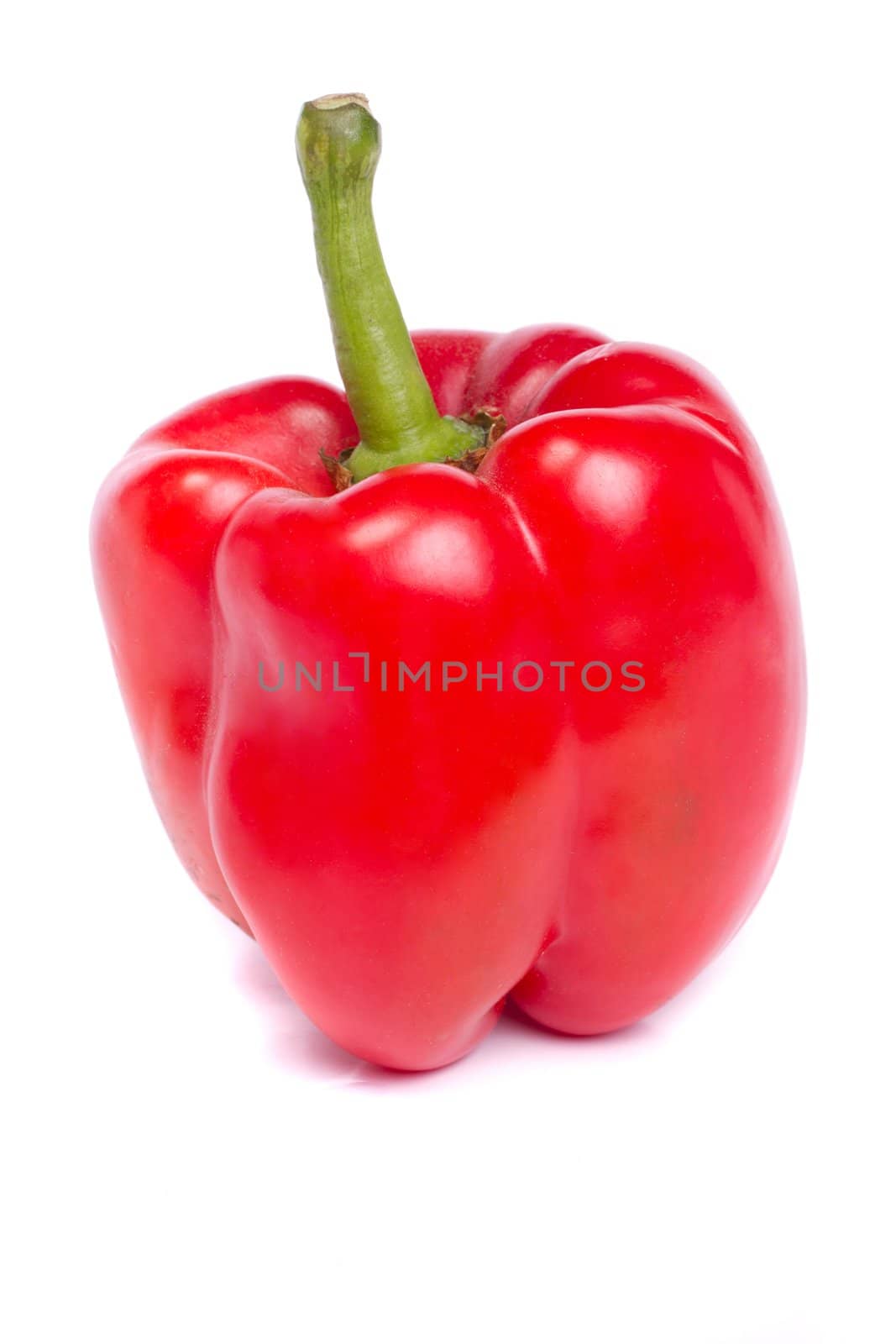 Close up view of a fresh red bell pepper isolated on a white background.