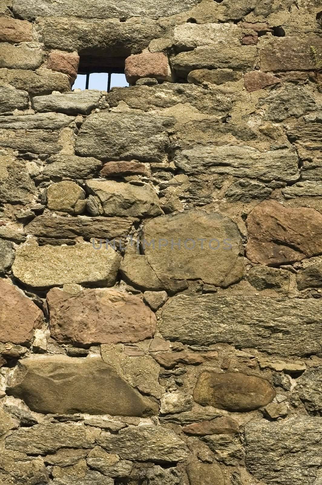 old castle wall and small grilled window