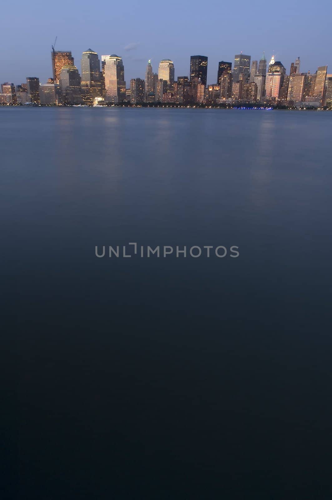 manhattan skyscrapers, hudson river in foreground, calm water, can be used as background