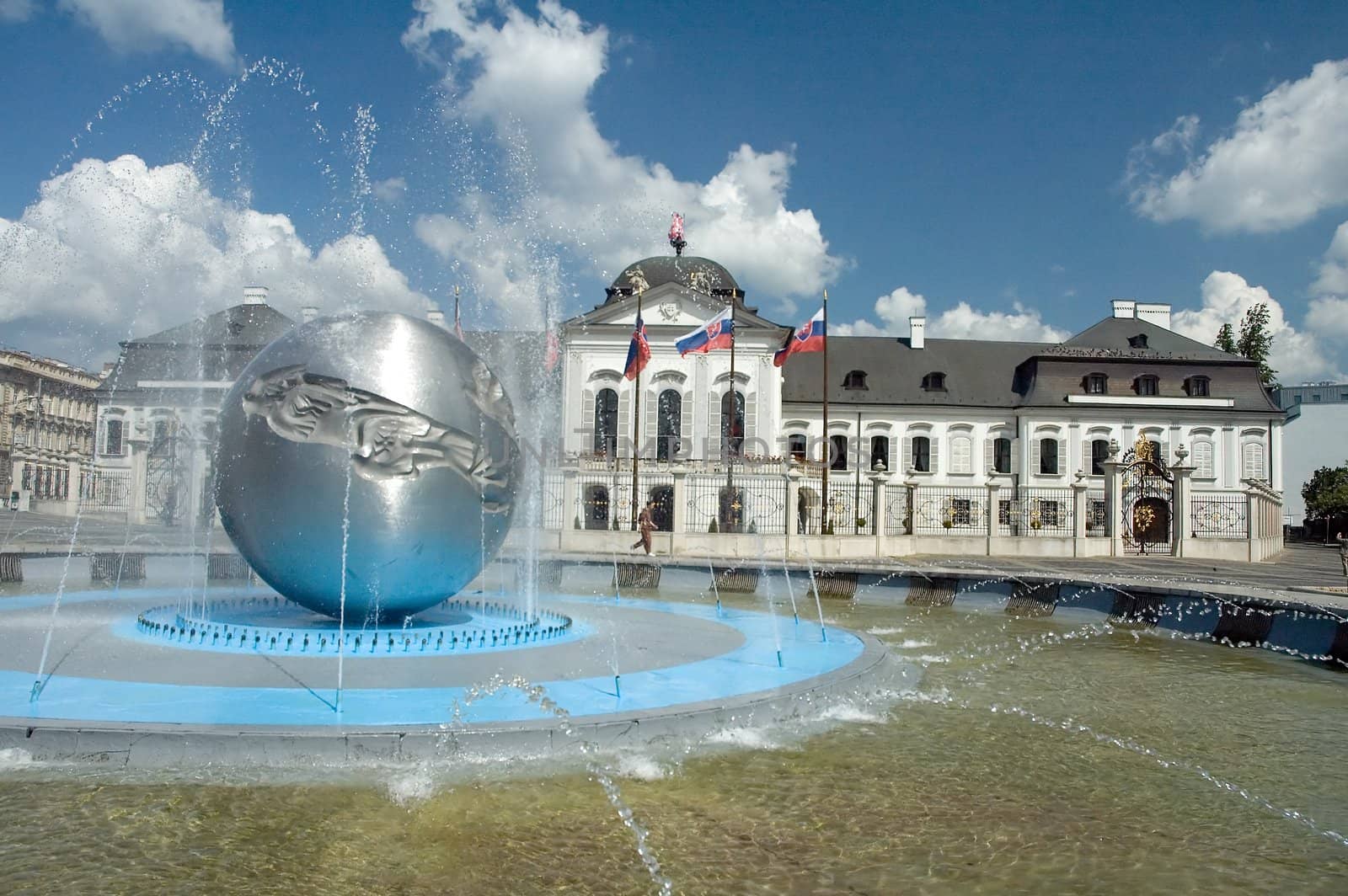 Grassalkovichov palace. fountain in foreground, nice sunny day