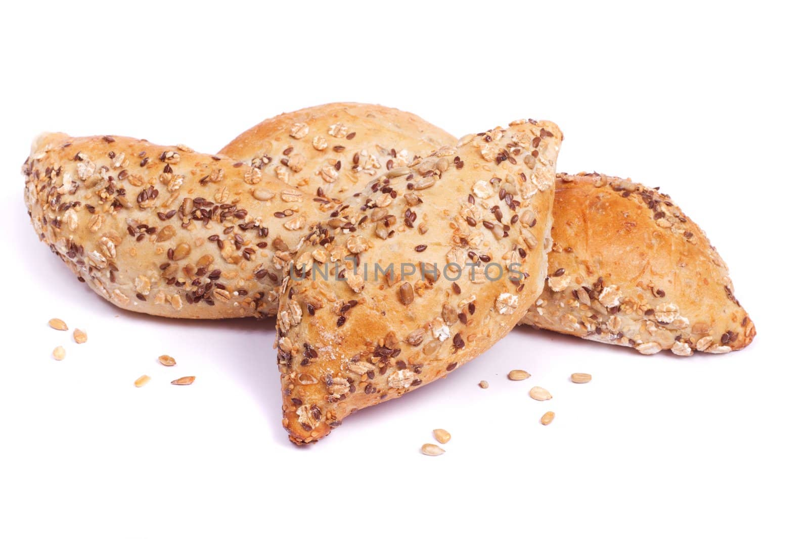 Close view of some fresh cereal bread isolated on a white background.