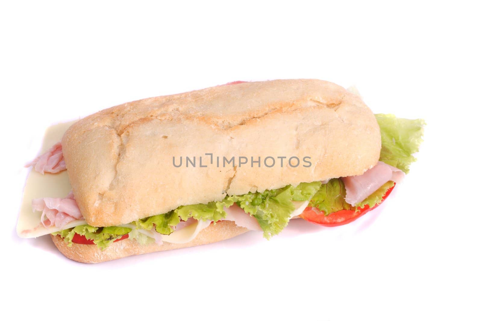 Close view of a fresh tasty ciabatta sandwich with tomato, lettuce, cheese and ham isolated on a white background.
