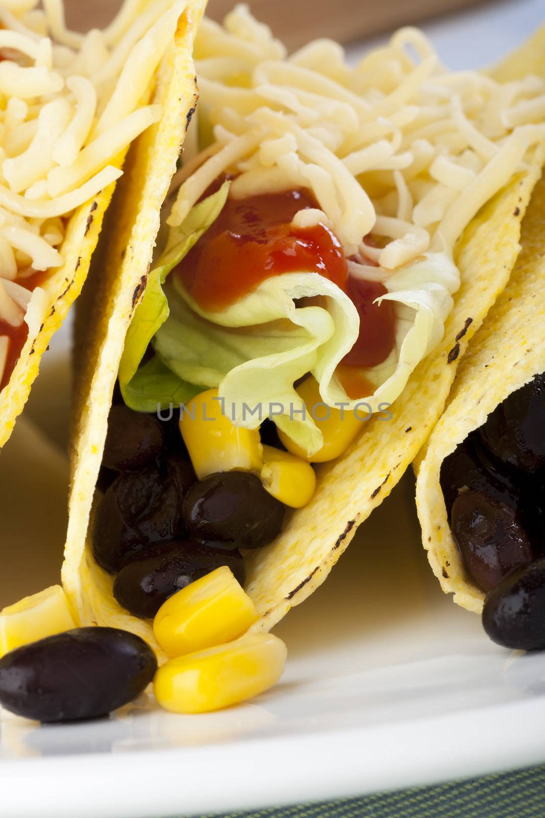 Homemade vegetarian tacos with black beans and sweet corn.