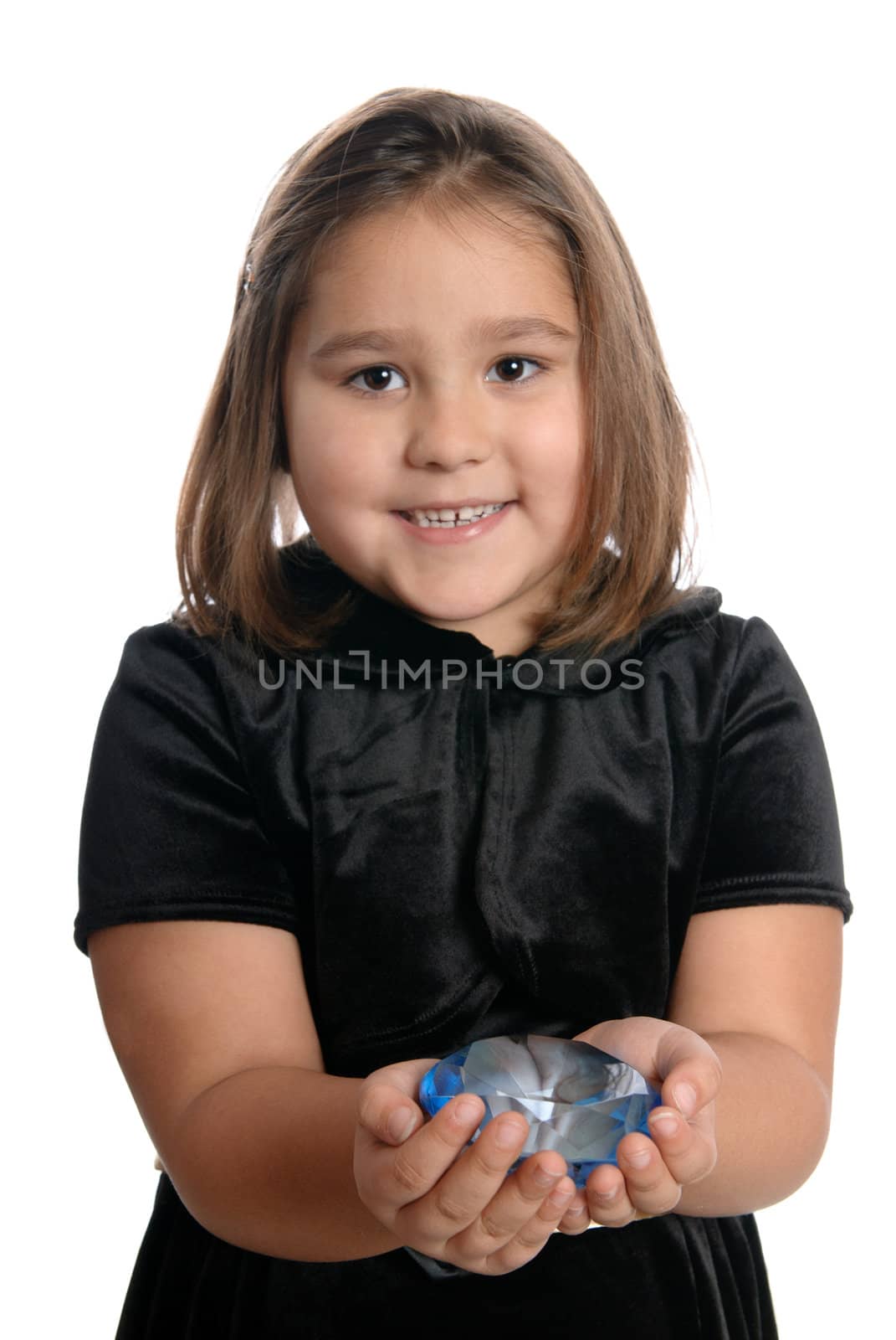 A rich little girl is showing off a blue diamond, isolated against a white background.