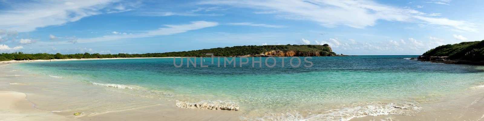 Circular sandy bay off the south west coast of Puerto Rico by Los Morillos Lighthouse