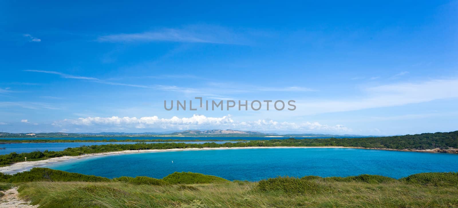 Circular sandy bay off the south west coast of Puerto Rico by Los Morillos Lighthouse