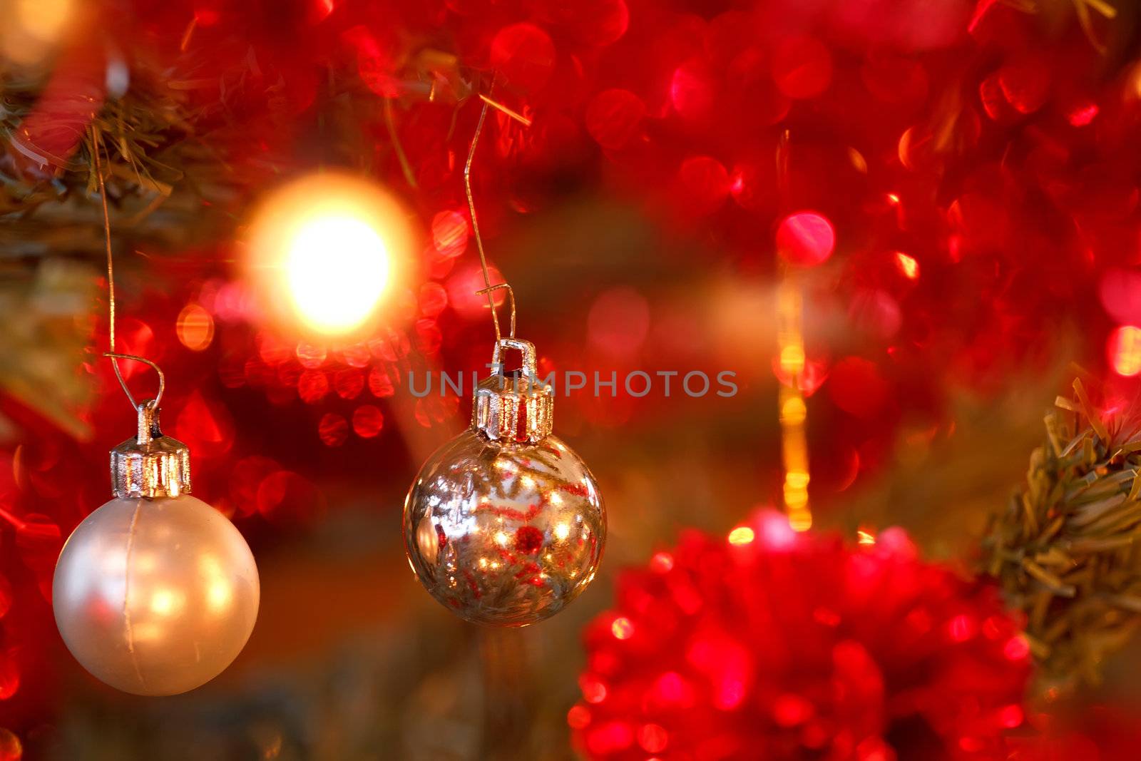 closeup detail of Christmas decoration on tree with light
