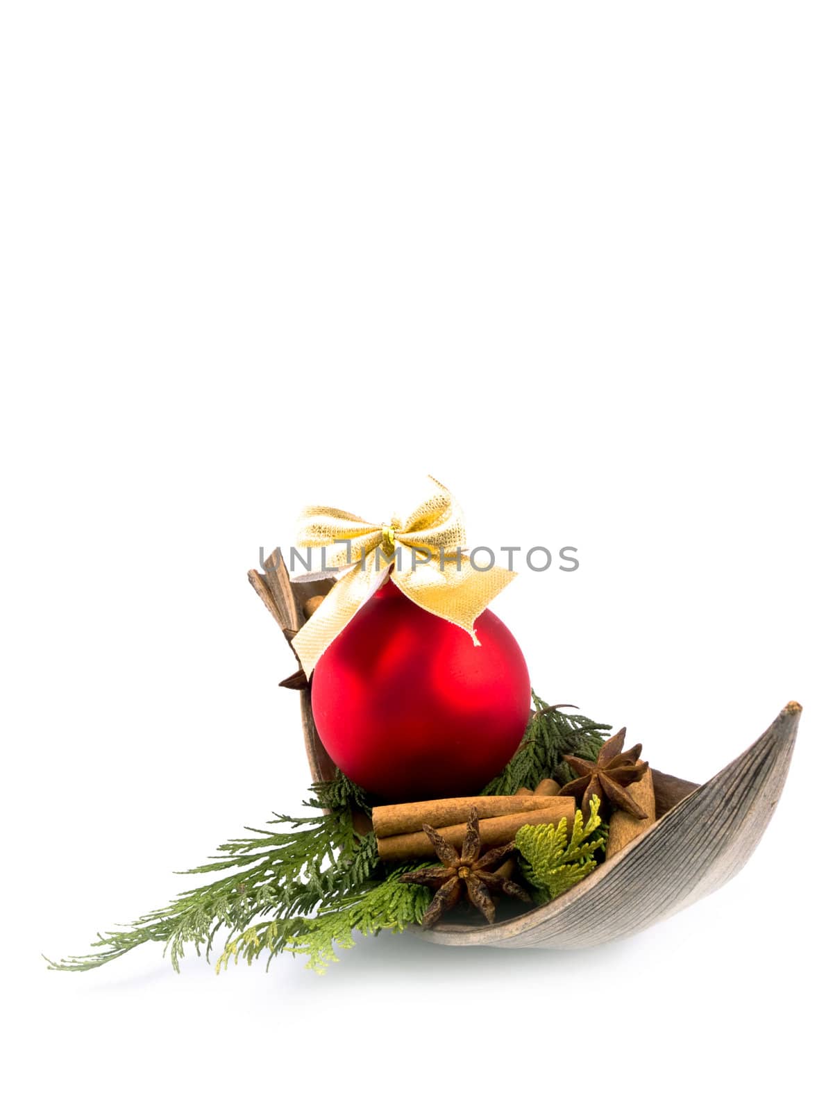 Christmas arrangement with thuja branches and red christmas ball on white background. Available space for text.