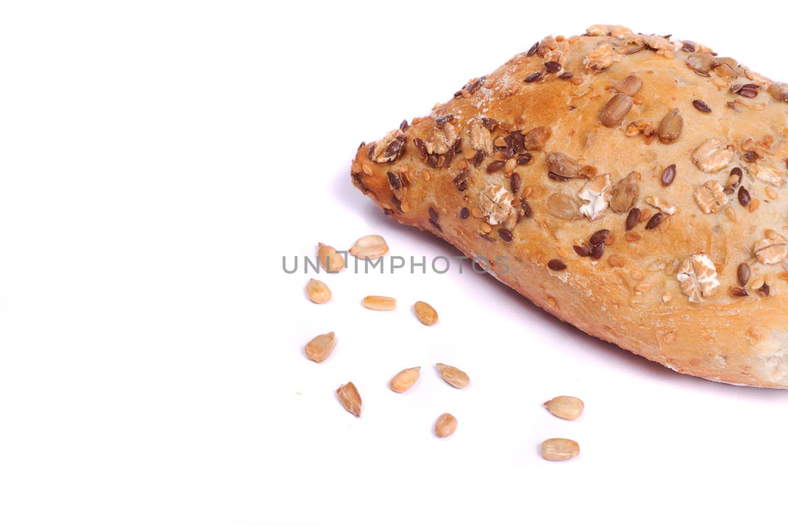 Close view of some fresh cereal bread isolated on a white background.