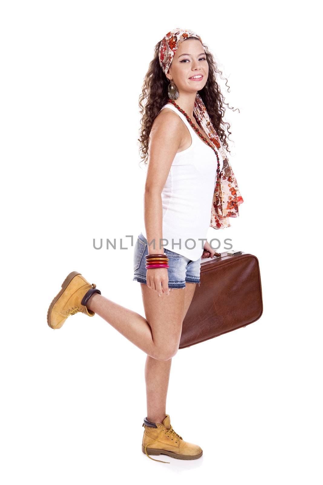 Beautiful and young fashion woman with a old suitcase, isolated on white background