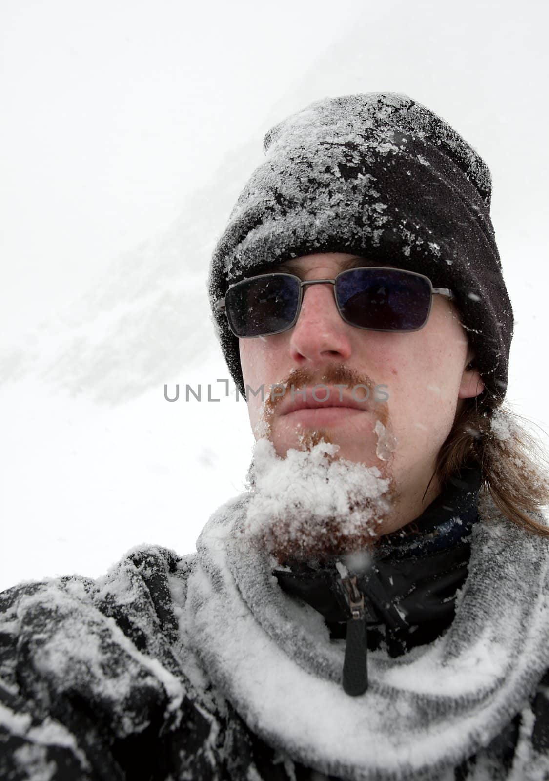 Man in a blizzard with frozen beard