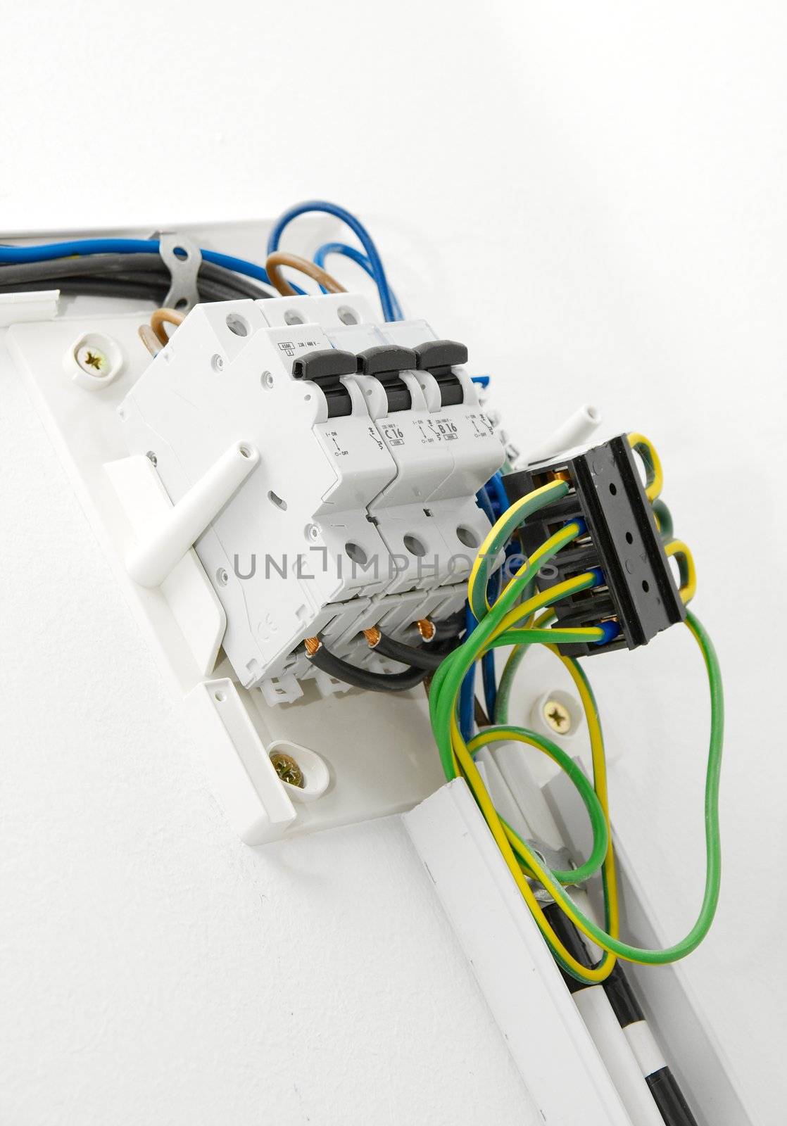 Electric wiring on white wall in a house