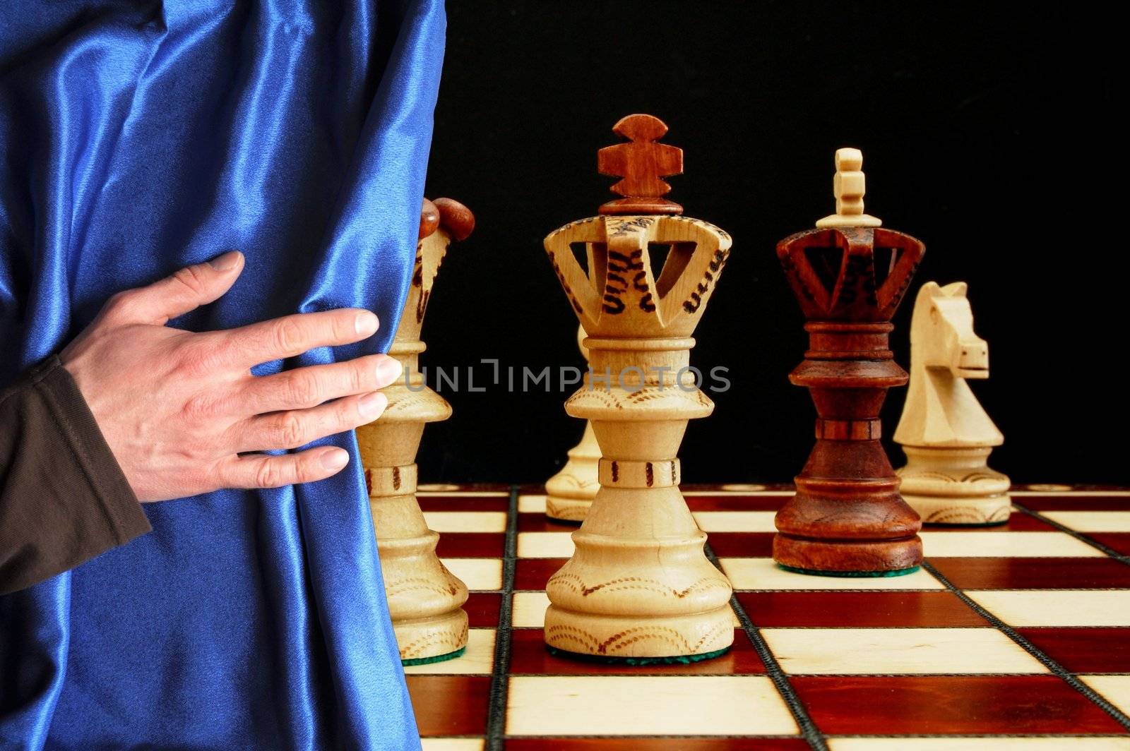 chess and curtain showing strategic business behavior