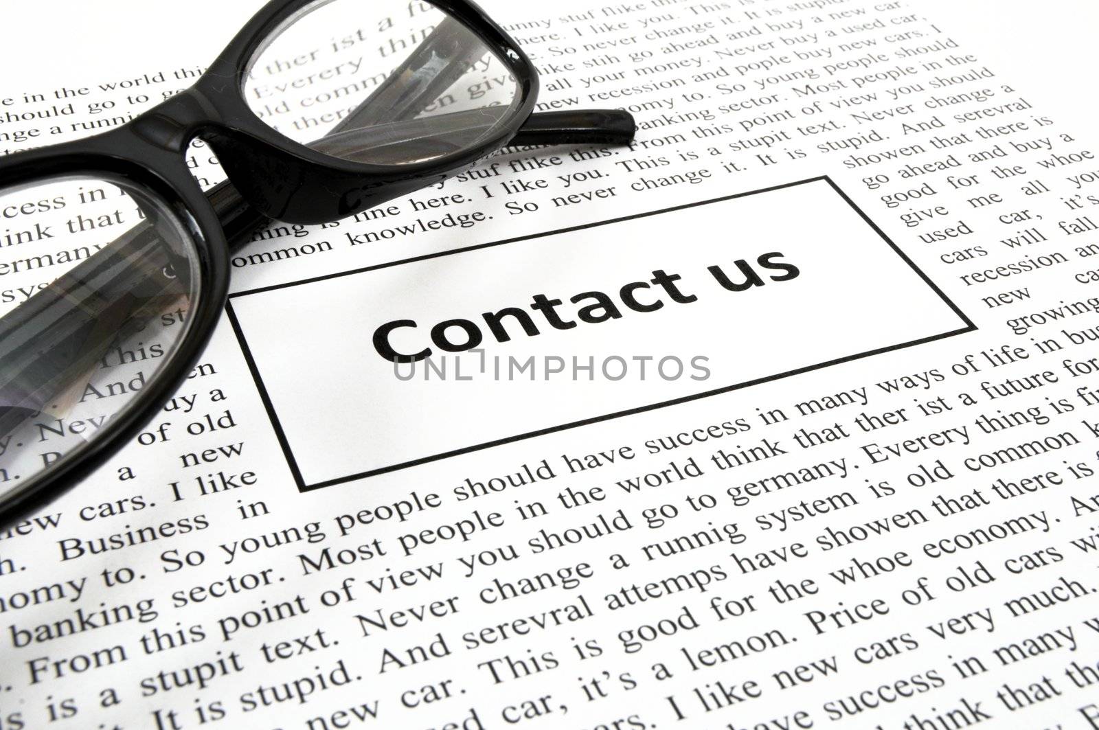 contact us concept with newspaper showing business communication