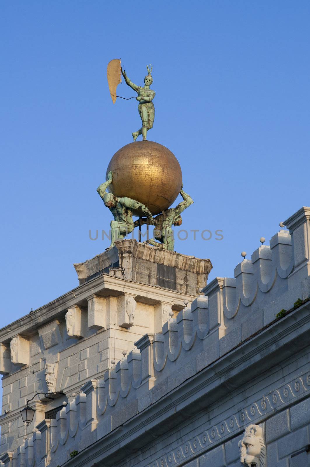 Statue at the top of Dogana di Mare (Sea Customs), Venice, Italy