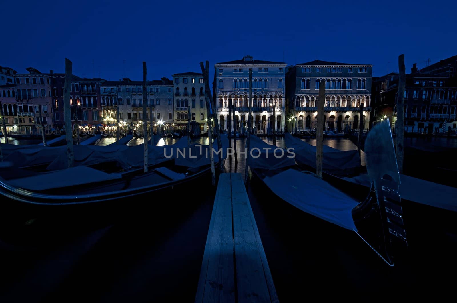 Gondolas over old buildings of Venice, Italy