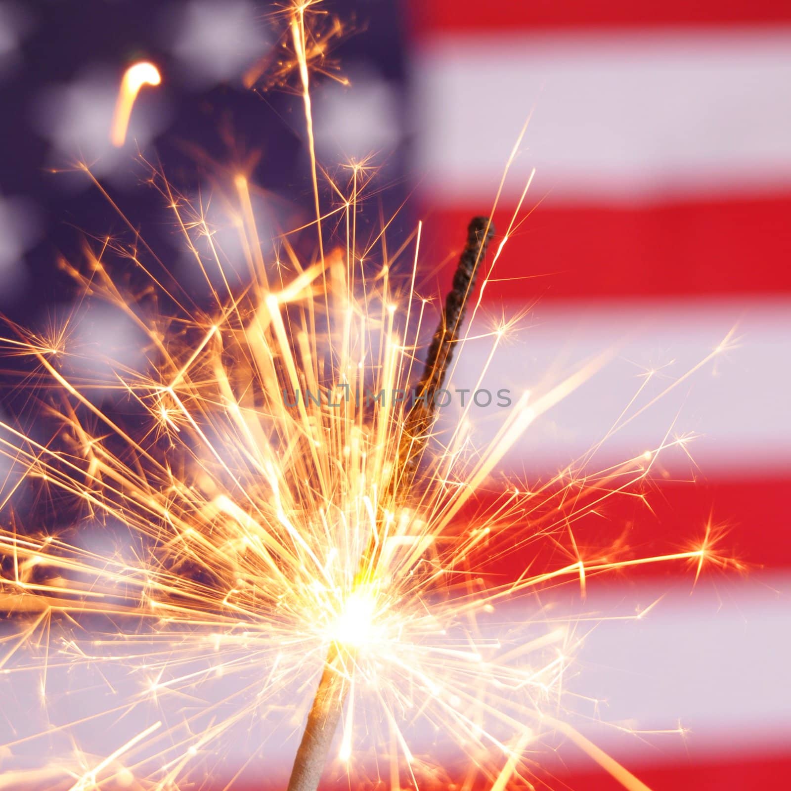 fourth of july concept with sparkler and usa flag