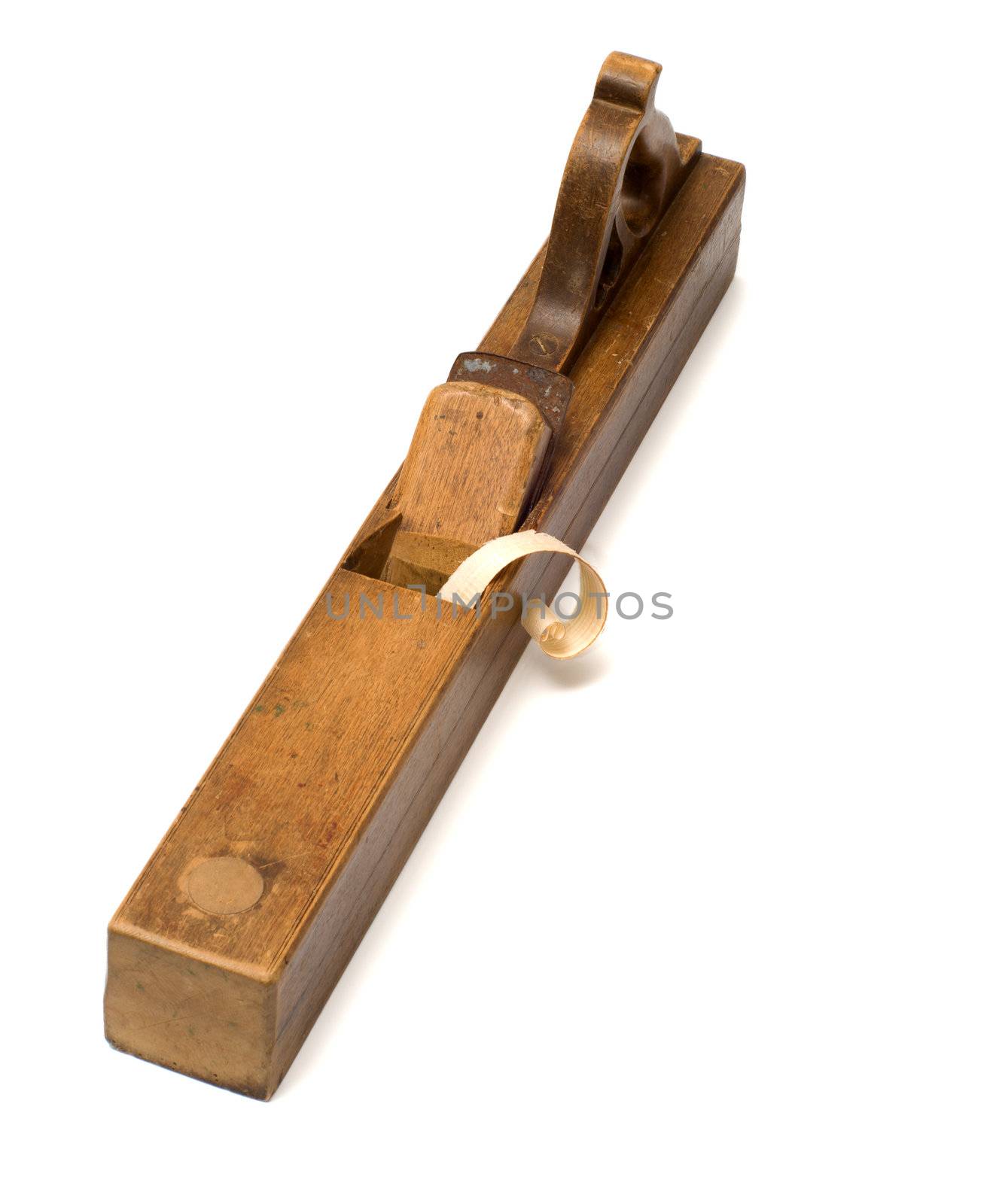 Old wooden jointer with chips on a white background.