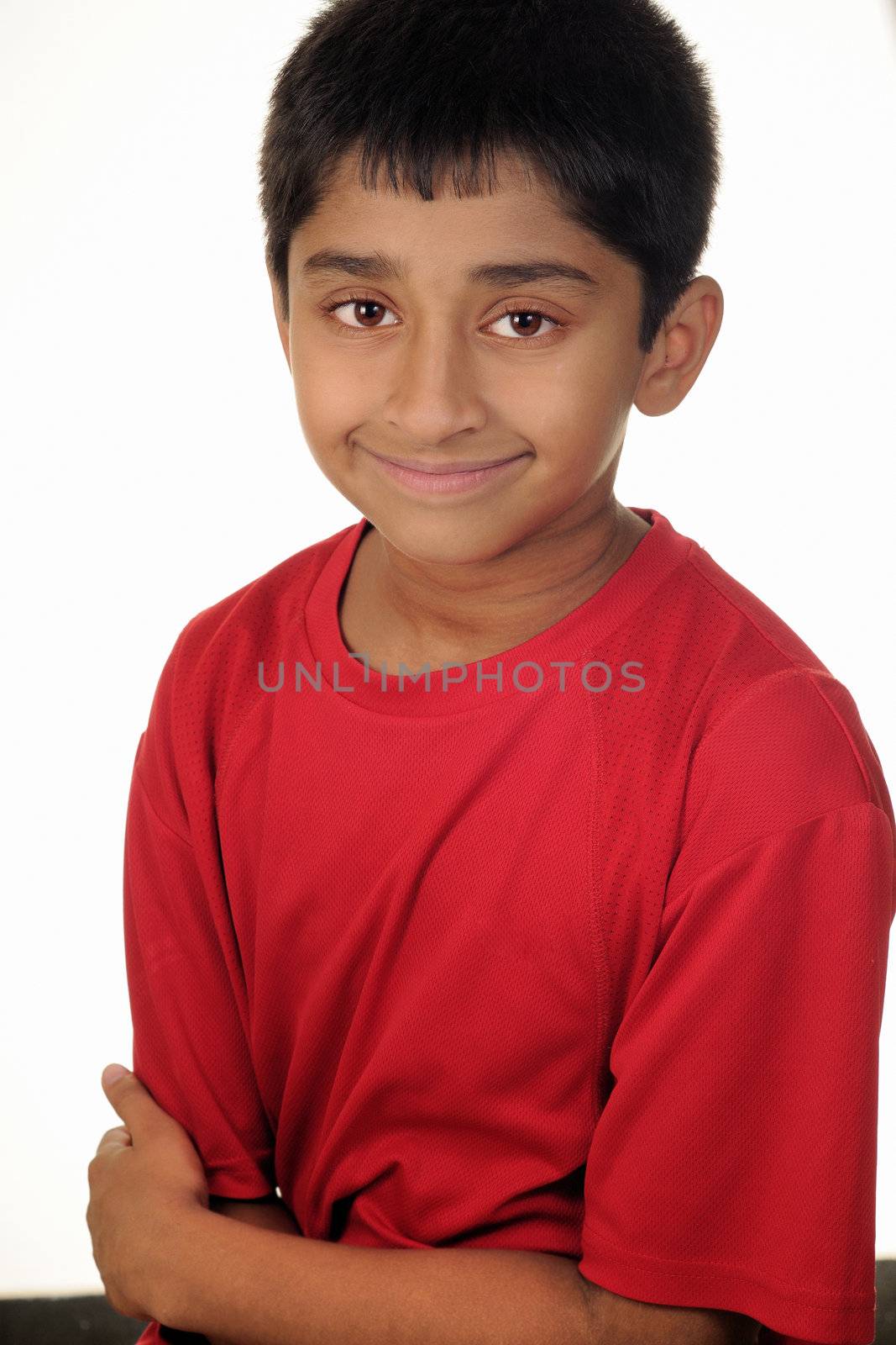 An handsome Indian kid looking very kind