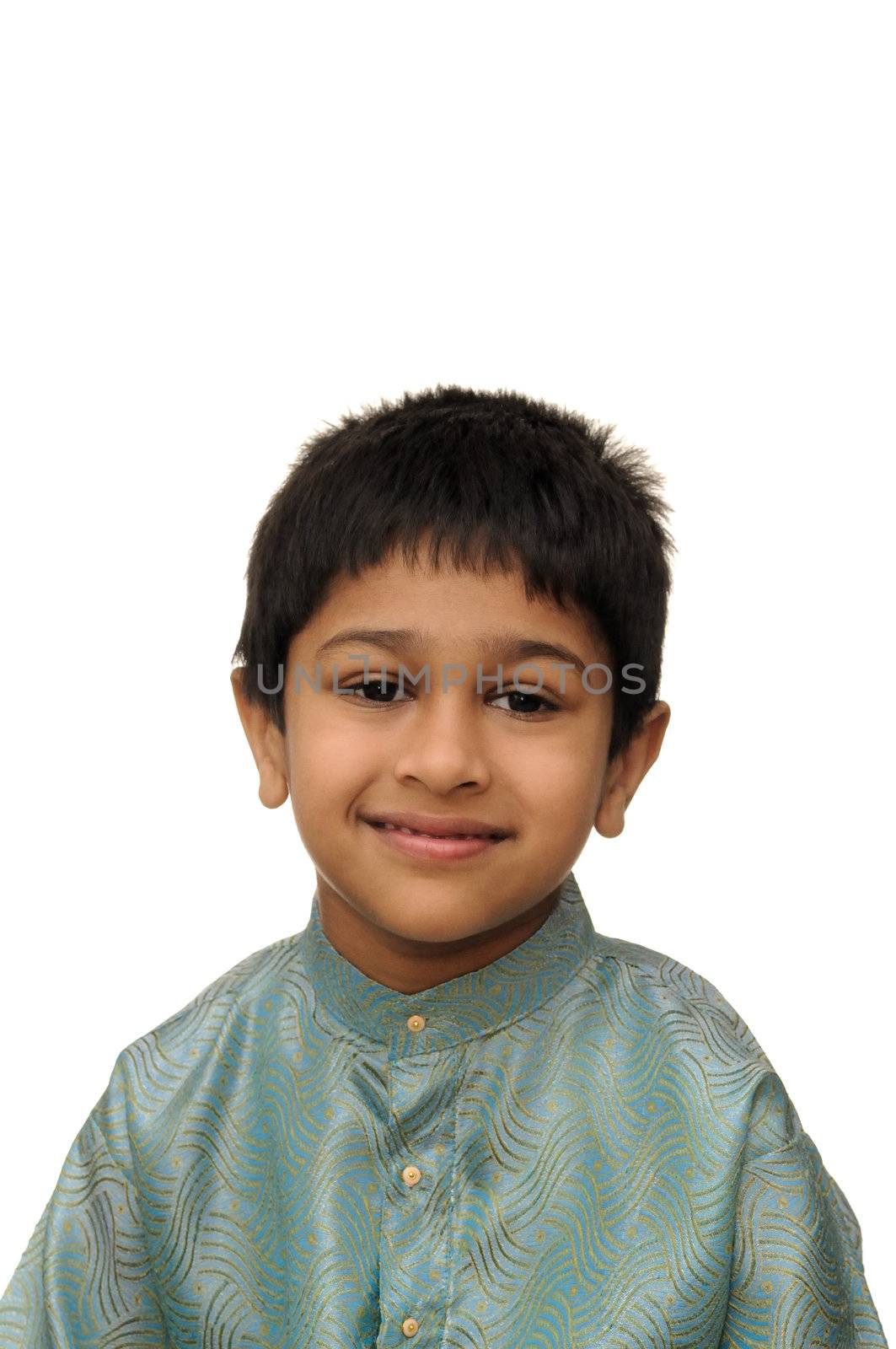An hanbdsome young Indian child smiling for you
