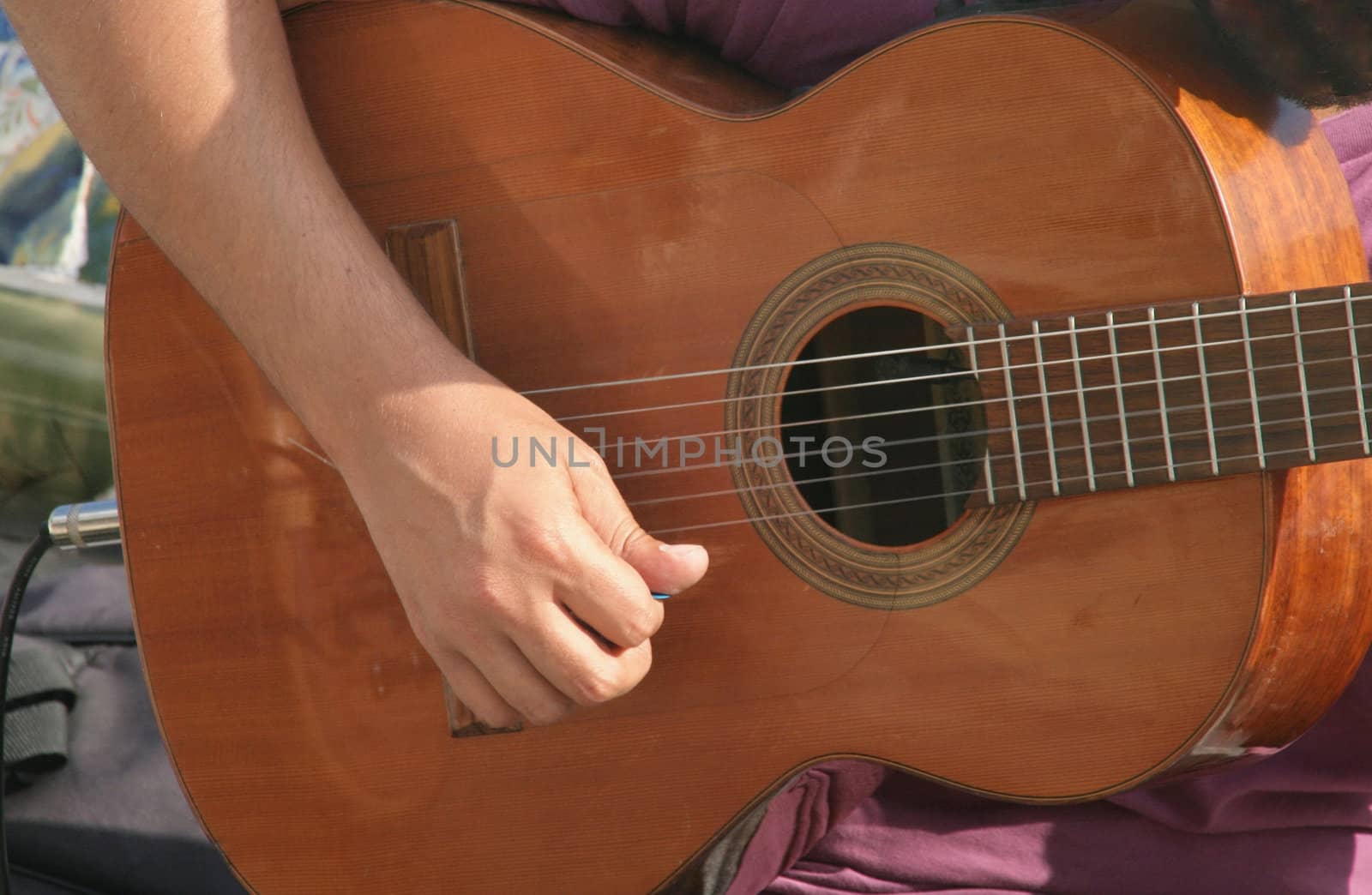 A musician playing guitar in the street