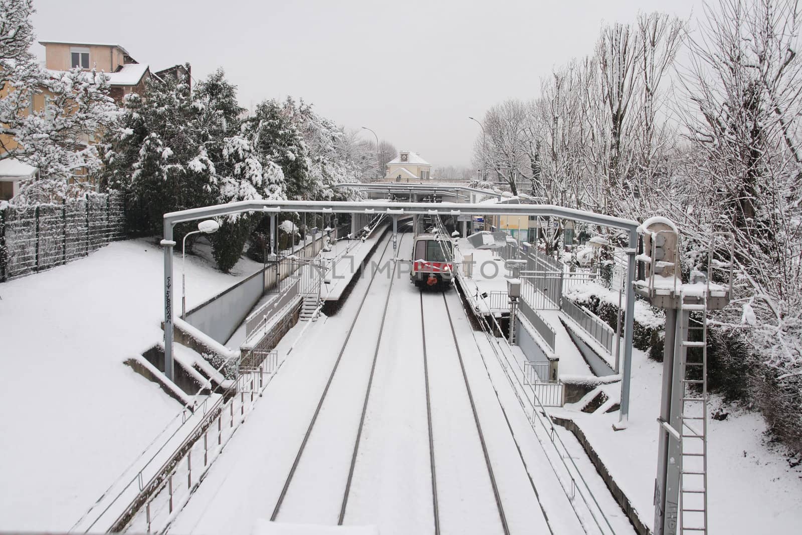 station with train under the snow (france). difficulty of traffic