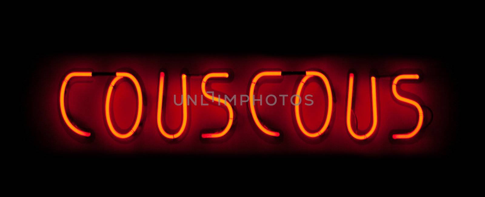 Couscous neon sign in red on black background in France