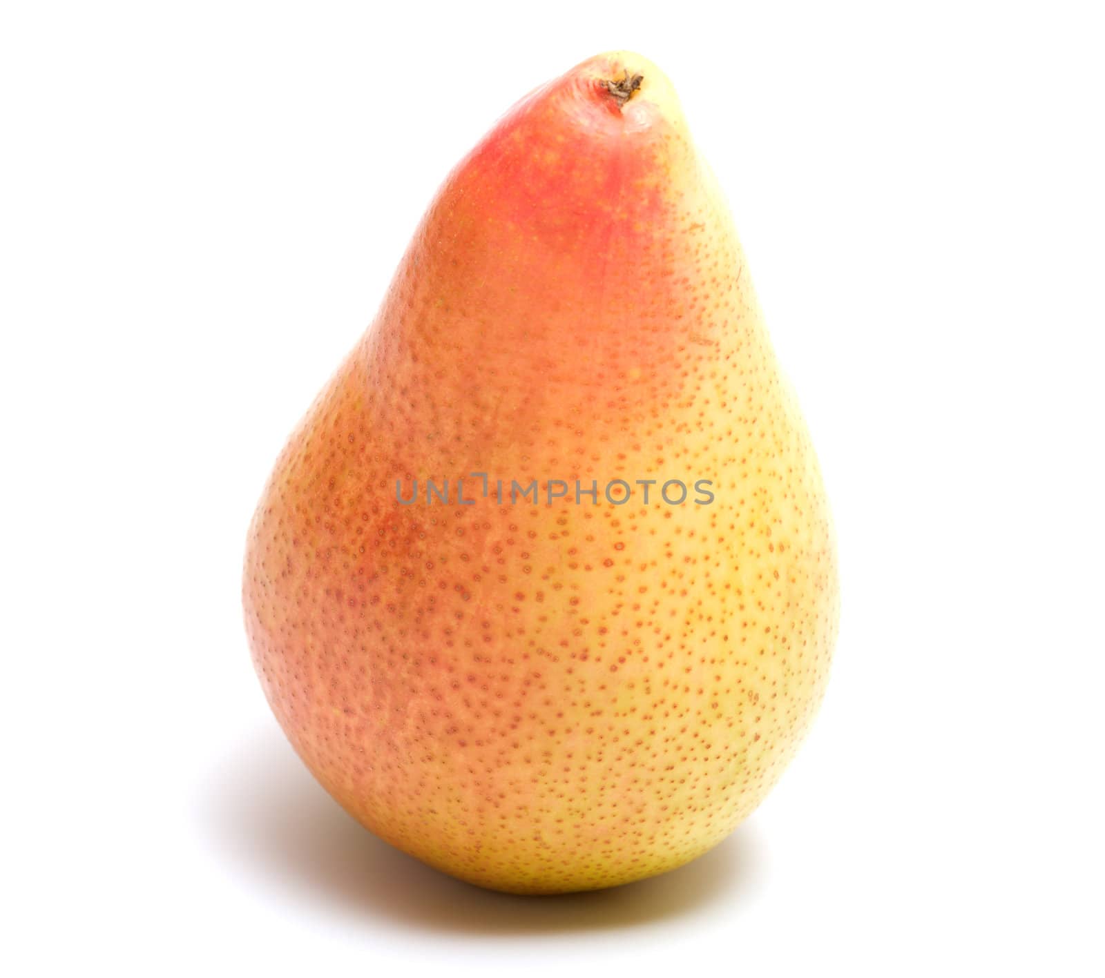 Ripe pear closeup isolated on white background.