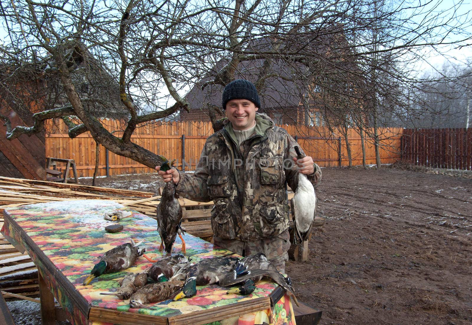 Outdoor shot of hunter shows the extracted game.