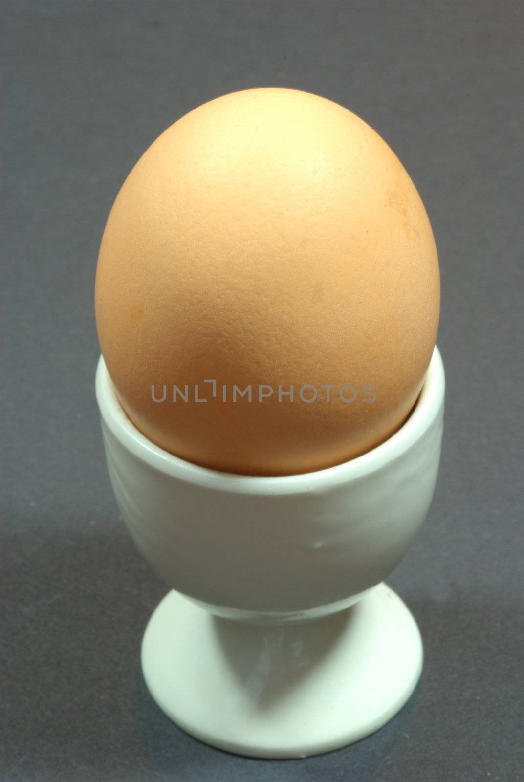 Brown egg in egg cup