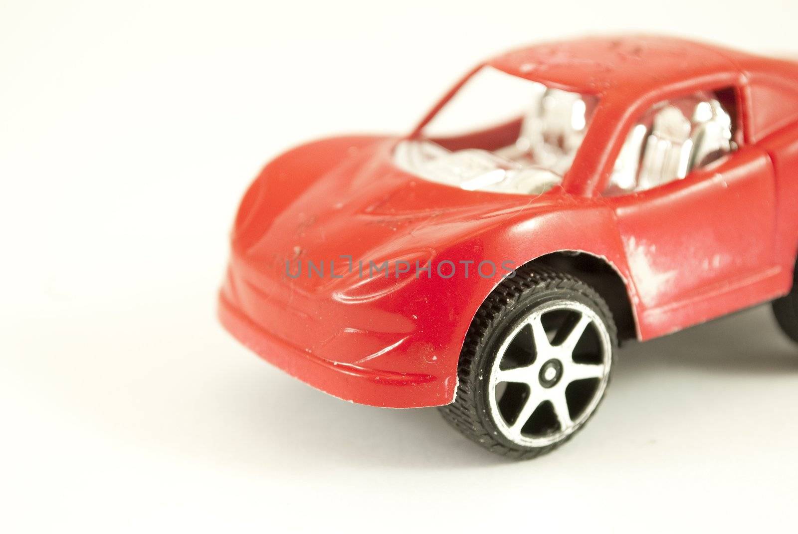 red toy car by lauria