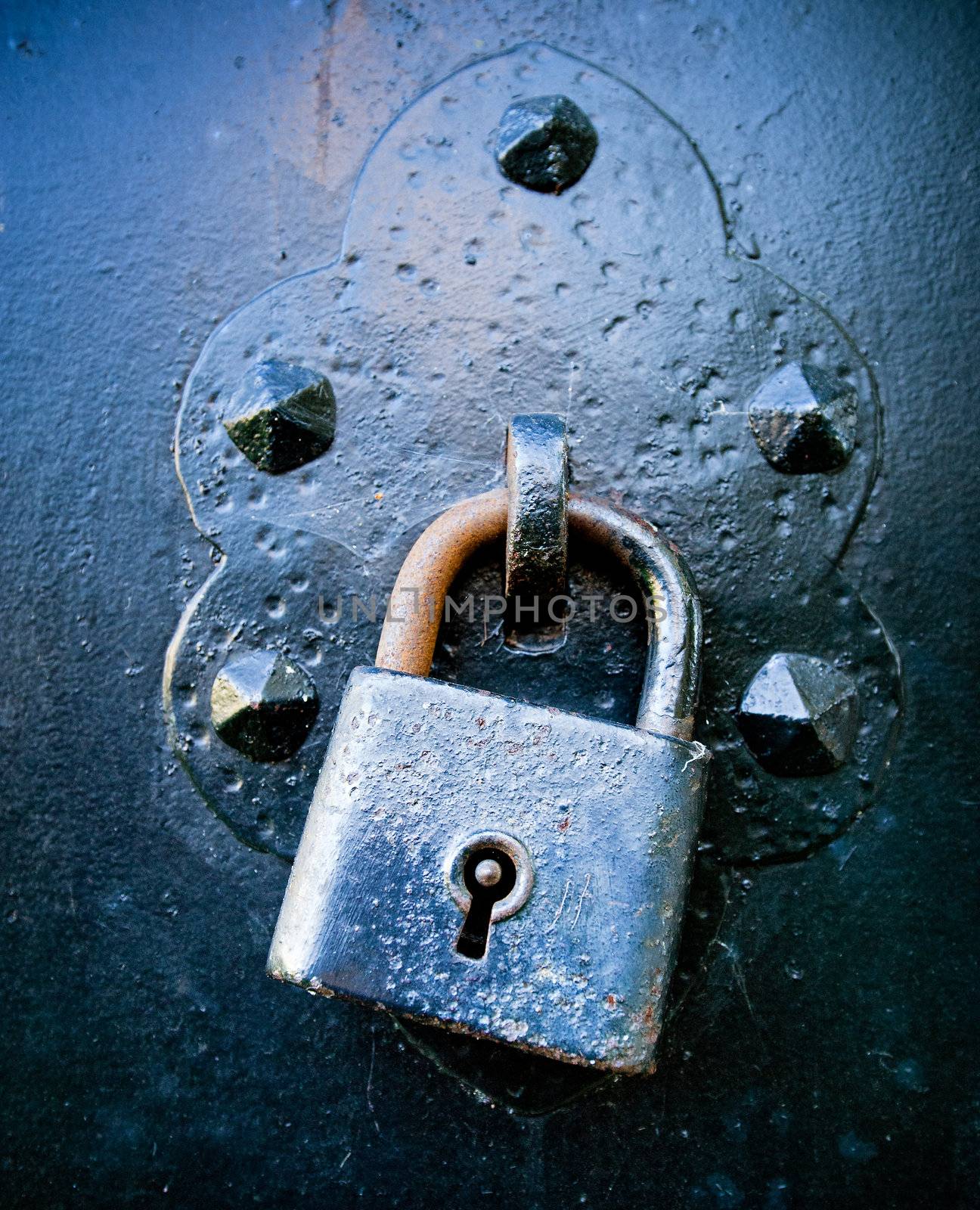 Rusty Lock on a wrought iron Door