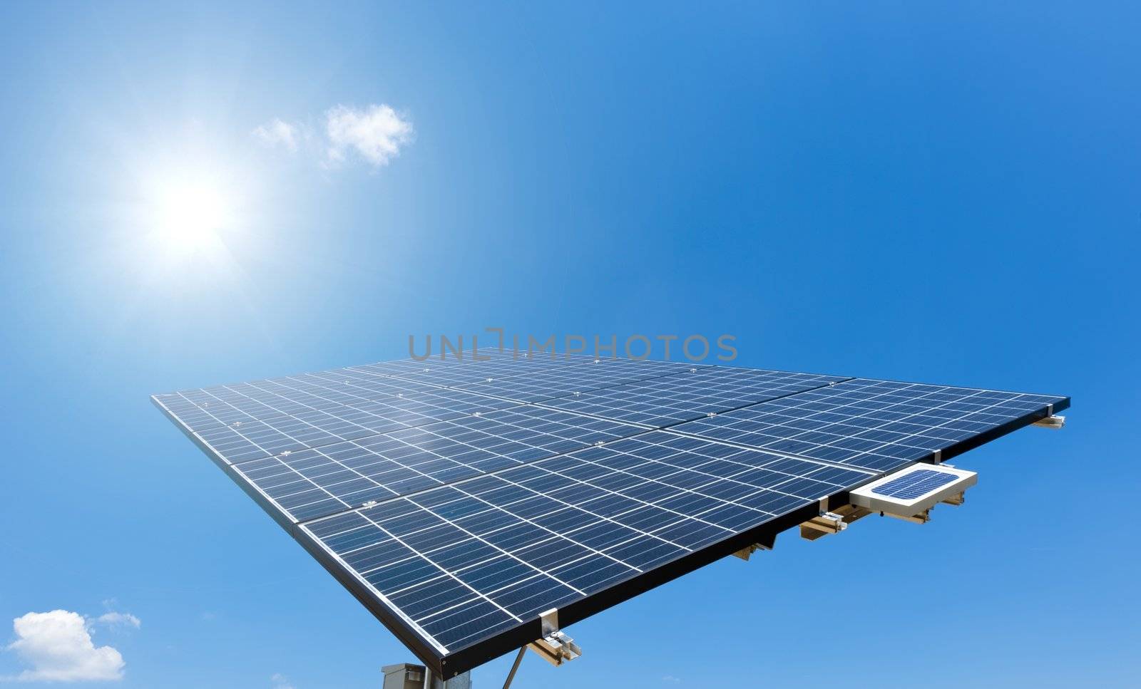 Sun shines on Solar Panel with blue Sky