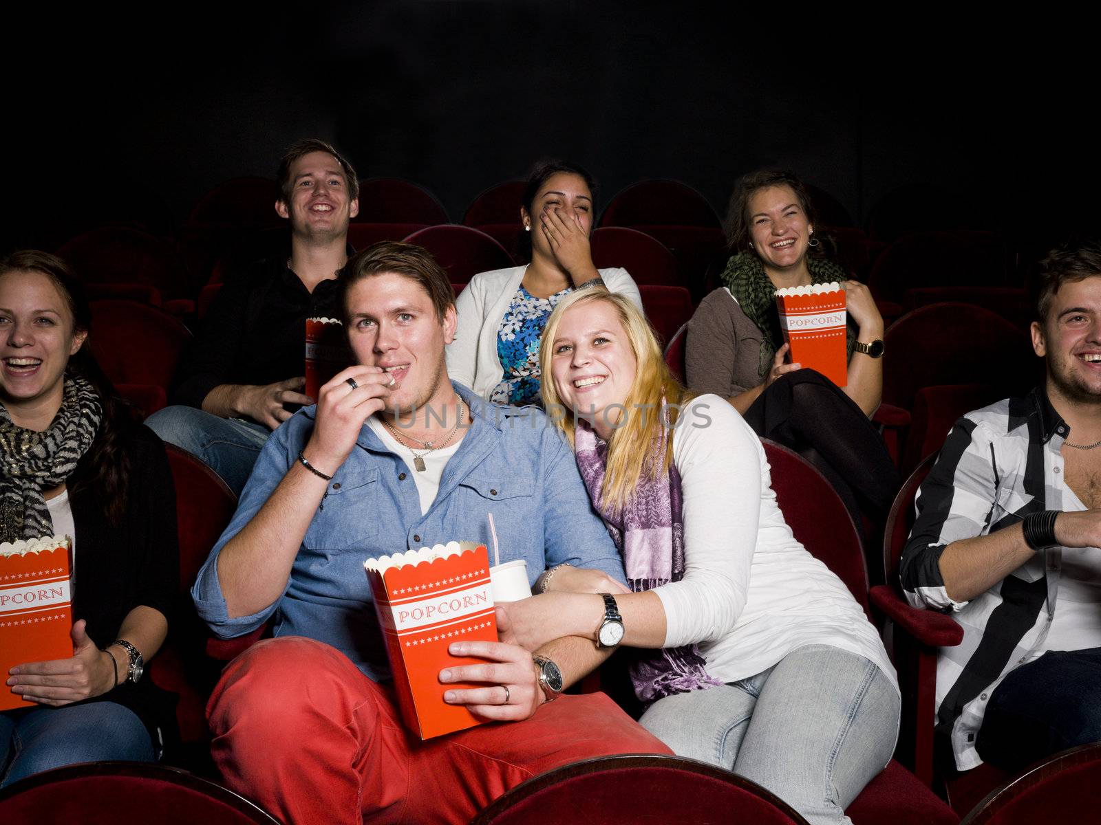 Young couple at cinema by gemenacom