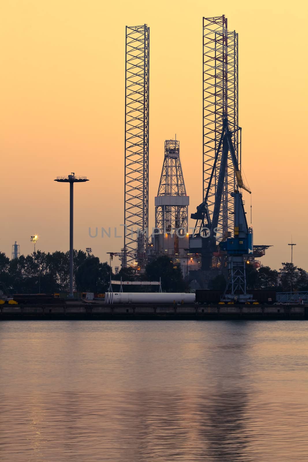 Industrial view - Drilling rig by evening light by Colette