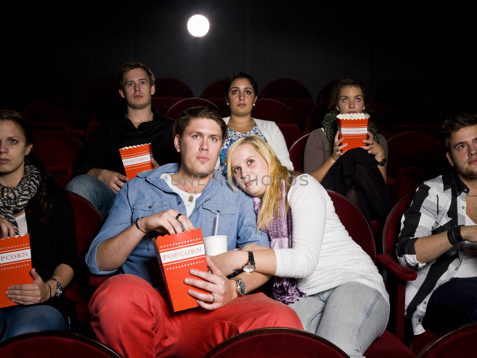 Scared couple at cinema by gemenacom