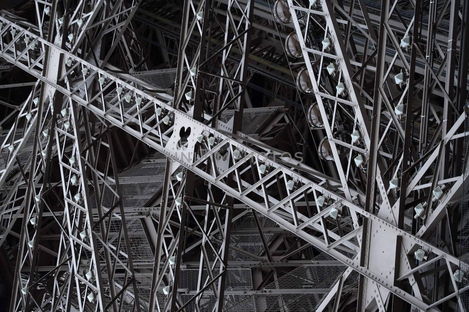 Abstract image of the criss-crossing support structure of the Eiffel Tower.