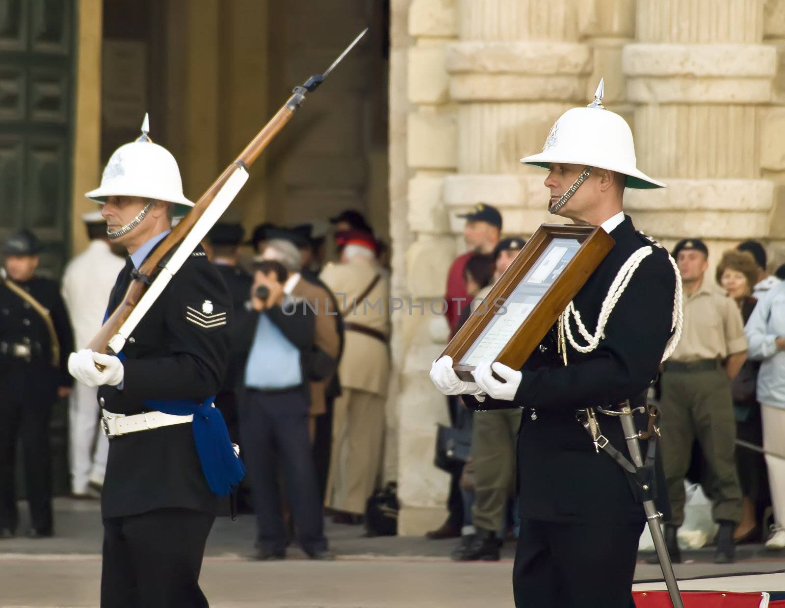Officer carrying the original George Cross medal which was awarded to Malta in 1942    